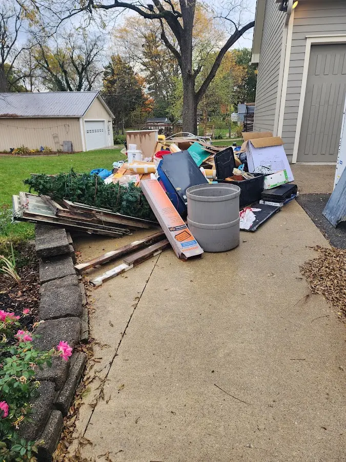 Dumpster being loaded with debris for Roofing Dumpster Rental in Archdale